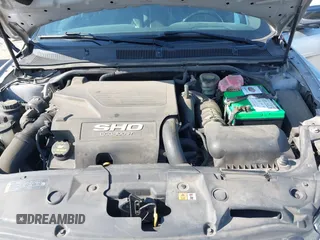 2014 Ford Taurus SHO with VIN 1FAHP2KT8EG123342, listed as a IAAI auction lot 42095390 with 142,957 mi miles. Bid and sale history available at carsss.com. Image 10.