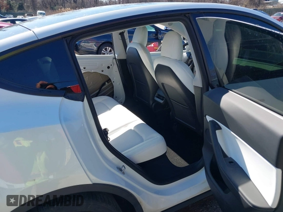 2021 Tesla Model Y Performance with VIN 5YJYGDEF8MF246658, listed as a IAAI auction lot 41679793 with 28,015 mi miles and . Bid and sale history available at DreamBid. Image 8.