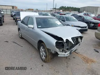 2002 Mercedes-Benz E-Class with VIN WDBJF65J62B460700, listed as a IAAI auction lot 41277847 with 1 mi miles. Bid and sale history available at carsss.com. Image 1.