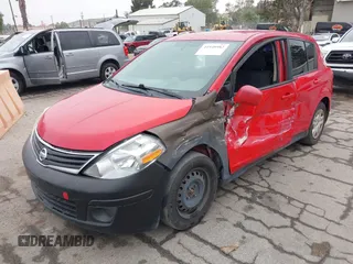 2012 Nissan Versa S with VIN 3N1BC1CP2CL369757, listed as a IAAI auction lot 41948982 with 219,466 mi miles. Bid and sale history available at carsss.com. Image 2.