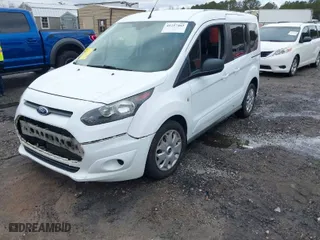 2015 Ford Transit Connect Wagon XLT with VIN NM0AE8F7XF1219105, listed as a IAAI auction lot 41237462 with 135,209 mi miles. Bid and sale history available at carsss.com. Image 2.