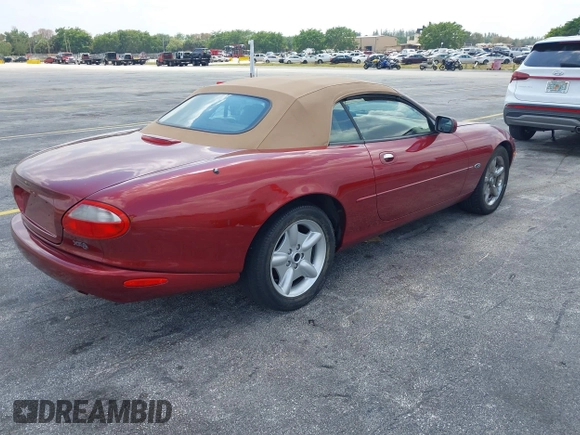 1997 Jaguar XK with VIN SAJGX2743VC017588, listed as a IAAI auction lot 42055716 with 66,052 mi miles and . Bid and sale history available at DreamBid. Image 4.