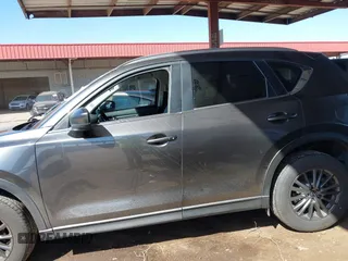 2021 Mazda CX-5 Touring with VIN JM3KFACM2M1313750, listed as a IAAI auction lot 41762938 with 68,503 mi miles. Bid and sale history available at carsss.com. Image 14.
