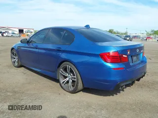 2013 BMW M5 with VIN WBSFV9C56DC774032, listed as a IAAI auction lot 42124754 with 55,409 mi miles. Bid and sale history available at carsss.com. Image 3.