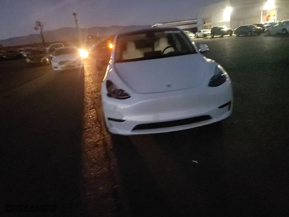 2023 Tesla Model Y Long Range with VIN 7SAYGDEE5PF867869, listed as a Copart auction lot 85119634 with 20,994 mi miles and Salvage Title. Bid and sale history available at carsss.com. Image 11.