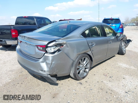 2015 Mazda 6 i Grand Touring with VIN JM1GJ1W52F1195333, listed as a IAAI auction lot 42014865 with 107,039 mi miles and . Bid and sale history available at DreamBid. Image 4.