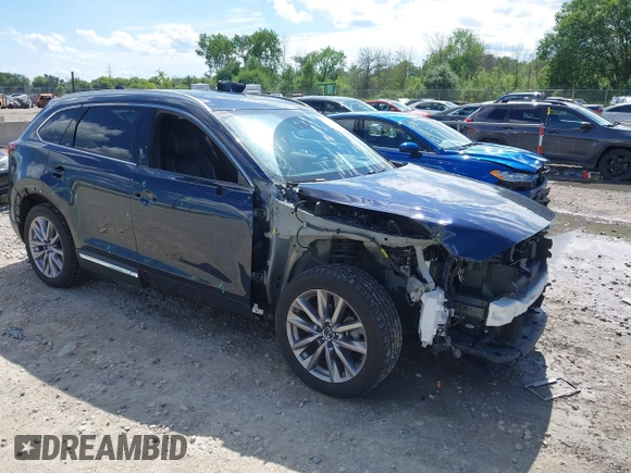 2021 Mazda CX-9 Grand Touring with VIN JM3TCBDY4M0513099, listed as a IAAI auction lot 42563530 with 76,006 mi miles and . Bid and sale history available at DreamBid. Image 1.