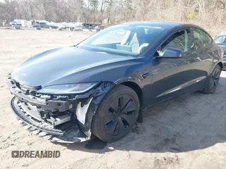 2024 Tesla Model 3 with VIN 5YJ3E1EA1RF735347, listed as a IAAI auction lot 41810655 with 14,901 mi miles. Bid and sale history available at carsss.com. Image 2.