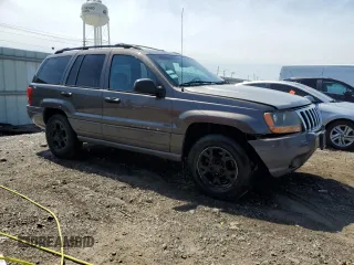 2000 Jeep Grand Cherokee Laredo z VIN 1J4GW48N9YC239166, wystawiony jako Copart lot #53321135 z przebiegiem 142 162 mil mil oraz Szkoda całkowita • Salvage title. Historia ofert i sprzedaży dostępna na DreamBid. Obrazek 4.