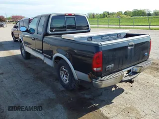 1997 Ford F-150 XL with VIN 1FTDX18W6VKD46643, listed as a IAAI auction lot 42111129 with 107,025 mi miles. Bid and sale history available at carsss.com. Image 3.