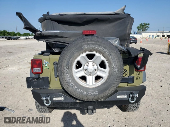 2013 Jeep Wrangler Sport with VIN 1C4AJWAG3DL649487, listed as a Copart auction lot 52568285 with 106,644 mi miles and Salvage title. Bid and sale history available at DreamBid. Image 6.