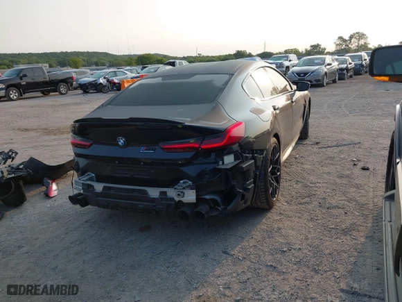 2020 BMW M8 with VIN WBSGV0C06LCD99264, listed as a IAAI auction lot 40276722 with 38,039 mi miles. Bid and sale history available at carsss.com. Image 4.