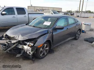 2019 Honda Civic Sedan LX with VIN 19XFC2F60KE018100, listed as a IAAI auction lot 41908486 with 124,357 mi miles. Bid and sale history available at carsss.com. Image 2.