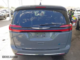 2023 Chrysler Pacifica Hybrid Touring L with VIN 2C4RC1L73PR509853, listed as a IAAI auction lot 41690872 with 83,014 mi miles. Bid and sale history available at carsss.com. Image 17.