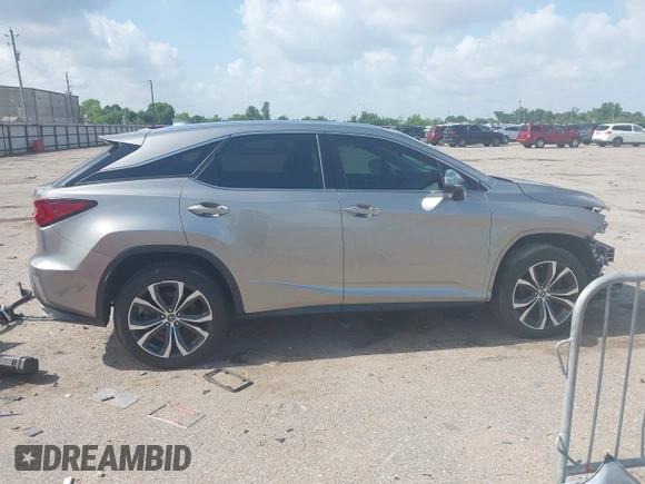 2019 Lexus RX 350 z VIN 2T2ZZMCA3KC123630, wystawiony jako IAAI lot #42436711 z przebiegiem 63 989 mil mil oraz . Historia ofert i sprzedaży dostępna na DreamBid. Obrazek 14.