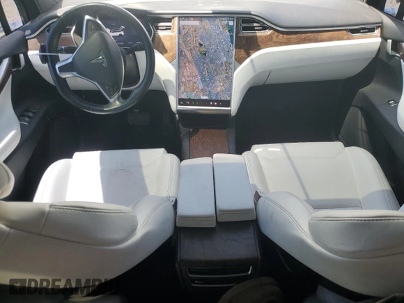 2016 Tesla Model X 70D with VIN 5YJXCAE28GF017100, listed as a Copart auction lot 50081235 with 126,962 mi miles and Salvage Title. Bid and sale history available at DreamBid. Image 8.