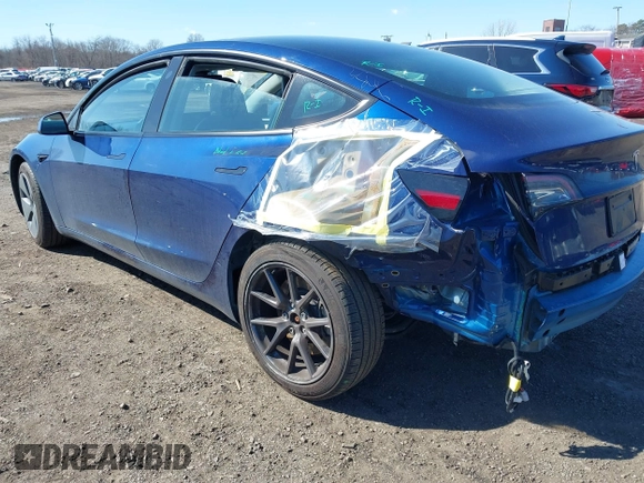 2023 Tesla Model 3 with VIN 5YJ3E1EA2PF690335, listed as a IAAI auction lot 41732701 with 22,238 mi miles and . Bid and sale history available at DreamBid. Image 6.