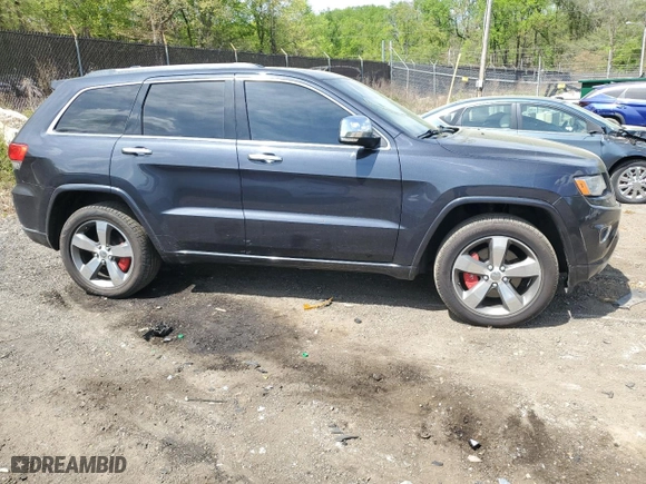 2014 Jeep Grand Cherokee Overland with VIN 1C4RJFCT1EC379867, listed as a Copart auction lot 54106375 with 217,908 mi miles and Clean Title. Bid and sale history available at carsss.com. Image 4.