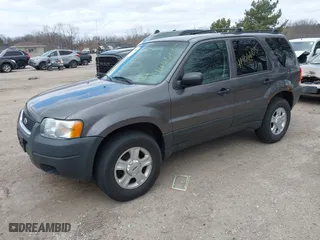 2003 Ford Escape XLT Popular 2 with VIN 1FMYU93103KA39840, listed as a IAAI auction lot 41966605 with 141,321 mi miles. Bid and sale history available at carsss.com. Image 2.
