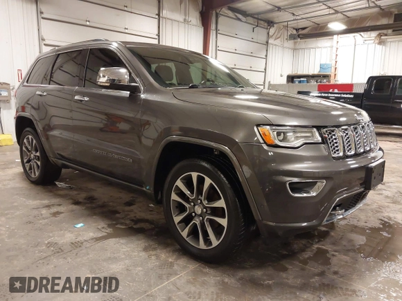2017 Jeep Grand Cherokee Overland z VIN 1C4RJFCG6HC641812, wystawiony jako IAAI lot #42053404 z przebiegiem 129 184 mil mil oraz . Historia ofert i sprzedaży dostępna na DreamBid. Obrazek 1.