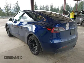 2023 Tesla Model Y Long Range with VIN 7SAYGDEEXPF621397, listed as a IAAI auction lot 41922714 with 29,460 mi miles. Bid and sale history available at carsss.com. Image 3.