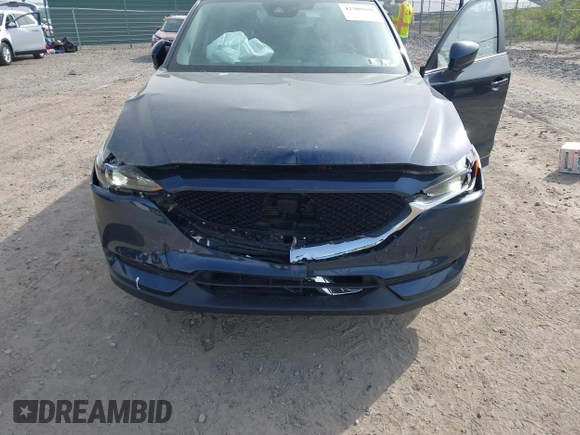 2021 Mazda CX-5 Touring z VIN JM3KFBCMXM0389857, wystawiony jako IAAI lot #42309650 z przebiegiem 49 938 mil mil oraz . Historia ofert i sprzedaży dostępna na DreamBid. Obrazek 6.