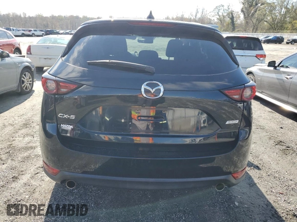 2018 Mazda CX-5 Grand Touring with VIN JM3KFADM5J0325794, listed as a Copart auction lot 79748544 with 106,781 mi miles and Salvage Title. Bid and sale history available at carsss.com. Image 6.