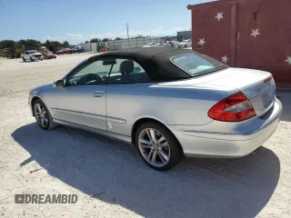 2007 Mercedes-Benz CLK-Class 3.5L with VIN WDBTK56FX7F206030, listed as a Copart auction lot 77271194 with 155,157 mi miles and Salvage Title. Bid and sale history available at carsss.com. Image 2.