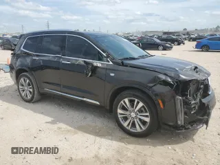 2023 Cadillac XT6 FWD Premium Luxury with VIN 1GYKPCRS6PZ127331, listed as a Copart auction lot 52951105 with 47,796 mi miles and Salvage Title. Bid and sale history available at carsss.com. Image 4.