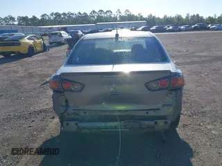 2015 Mitsubishi Lancer SE with VIN JA32V2FWXFU023626, listed as a IAAI auction lot 42012381 with 143,981 mi miles. Bid and sale history available at carsss.com. Image 16.