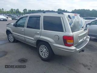 2004 Jeep Grand Cherokee Limited with VIN 1J4GX58SX4C255363, listed as a IAAI auction lot 42619798 with 239,475 mi miles and . Bid and sale history available at DreamBid. Image 3.