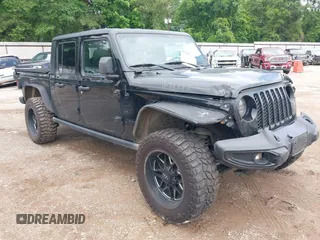 2021 Jeep Gladiator Sport S with VIN 1C6JJTAM7ML554412, listed as a IAAI auction lot 42199167 with 74,263 mi miles and . Bid and sale history available at DreamBid. Image 1.