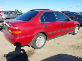 1997 Honda Civic LX with VIN 1HGEJ6678VL030963, listed as a IAAI auction lot 41880866 with 142,472 mi miles. Bid and sale history available at carsss.com. Image 4.