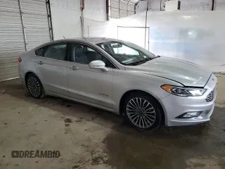 2017 Ford Fusion Hybrid Titanium with VIN 3FA6P0RU4HR223512, listed as a Copart auction lot 58739435 with 174,604 mi miles and Clean title. Bid and sale history available at DreamBid. Image 4.