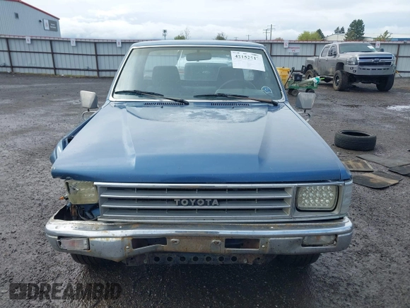 1988 Toyota Pickup with VIN JT4RN50R5J5169942, listed as a IAAI auction lot 42152517 with 218,579 mi miles and . Bid and sale history available at DreamBid. Image 13.