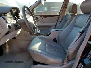 2002 Mercedes-Benz E-Class with VIN WDBJF65J32B494321, listed as a Copart auction lot 77557334 with 198,820 mi miles and Salvage Title. Bid and sale history available at carsss.com. Image 7.