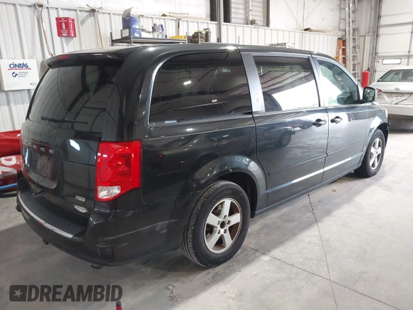 2013 Dodge Grand Caravan SXT with VIN 2C4RDGCG2DR527482, listed as a IAAI auction lot 42199622 with 198,248 mi miles and . Bid and sale history available at DreamBid. Image 4.