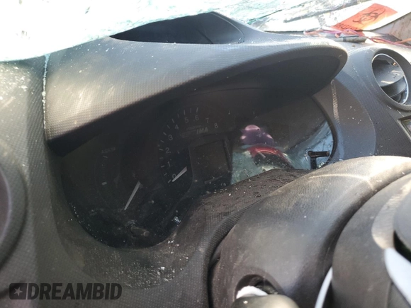 2012 Honda Insight EX z VIN JHMZE2H72CS006248, wystawiony jako Copart lot #73184844 z przebiegiem Nie podano mil oraz Szkoda całkowita • Salvage title. Historia ofert i sprzedaży dostępna na DreamBid. Obrazek 9.