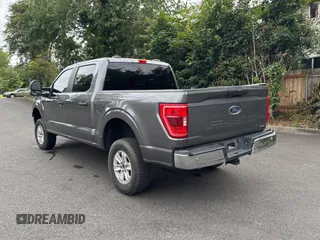 2021 Ford F-150 XL with VIN 1FTFW1E86MKD57397, listed as a Copart auction lot 62959355 with 59,227 mi miles and Salvage title. Bid and sale history available at DreamBid. Image 3.