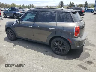 2011 MINI Countryman S with VIN WMWZC5C5XBWL55516, listed as a Copart auction lot 63239235 with 137,545 mi miles and Salvage title. Bid and sale history available at DreamBid. Image 2.