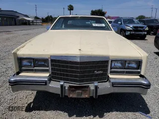 1985 Cadillac Eldorado z VIN 1G6EL5782FE675028, wystawiony jako Copart lot #57709655 z przebiegiem 63 347 mil mil oraz Tytuł czysty. Historia ofert i sprzedaży dostępna na DreamBid. Obrazek 5.