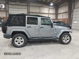 2014 Jeep Wrangler Unlimited Sahara with VIN 1C4BJWEG5EL164350, listed as a IAAI auction lot 42018586 with 113,222 mi miles. Bid and sale history available at carsss.com. Image 14.