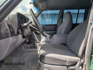 1998 Jeep Cherokee Sport with VIN 1J4FJ68SXWL210381, listed as a Copart auction lot 58398995 with 211,870 mi miles and Salvage title. Bid and sale history available at DreamBid. Image 7.