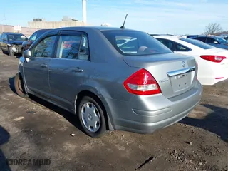 2007 Nissan Versa 1.8 S with VIN 3N1BC11EX7L404939, listed as a IAAI auction lot 41753426 with 163,944 mi miles. Bid and sale history available at carsss.com. Image 3.