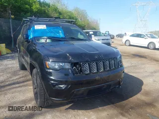 2018 Jeep Grand Cherokee Laredo E with VIN 1C4RJFAG2JC320441, listed as a IAAI auction lot 42095419 with 136,962 mi miles. Bid and sale history available at carsss.com. Image 6.