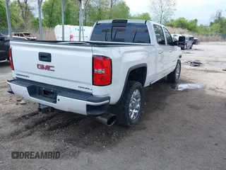 2016 GMC Sierra 2500HD Denali with VIN 1GT12UE86GF267431, listed as a IAAI auction lot 42091770 with 128,525 mi miles and . Bid and sale history available at DreamBid. Image 4.