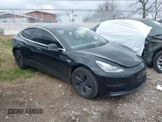 2019 Tesla Model 3 Mid Range with VIN 5YJ3E1EA2KF317028, listed as a IAAI auction lot 41781580 with 107,496 mi miles. Bid and sale history available at carsss.com. Image 1.