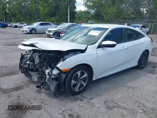 2020 Honda Civic LX z VIN 2HGFC2F65LH531818, wystawiony jako IAAI lot #41997104 z przebiegiem 68 878 mil mil oraz . Historia ofert i sprzedaży dostępna na DreamBid. Obrazek 18.