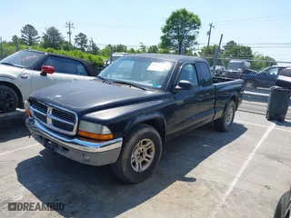 2004 Dodge Dakota SLT with VIN 1D7GL42N14S527342, listed as a IAAI auction lot 42081956 with 165,157 mi miles. Bid and sale history available at carsss.com. Image 2.