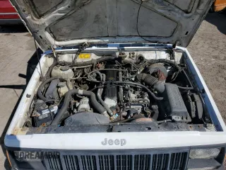 1993 Jeep Cherokee Sport with VIN 1J4FJ68S4PL555701, listed as a Copart auction lot 76020714 with 130,884 mi miles and Salvage Title. Bid and sale history available at carsss.com. Image 12.